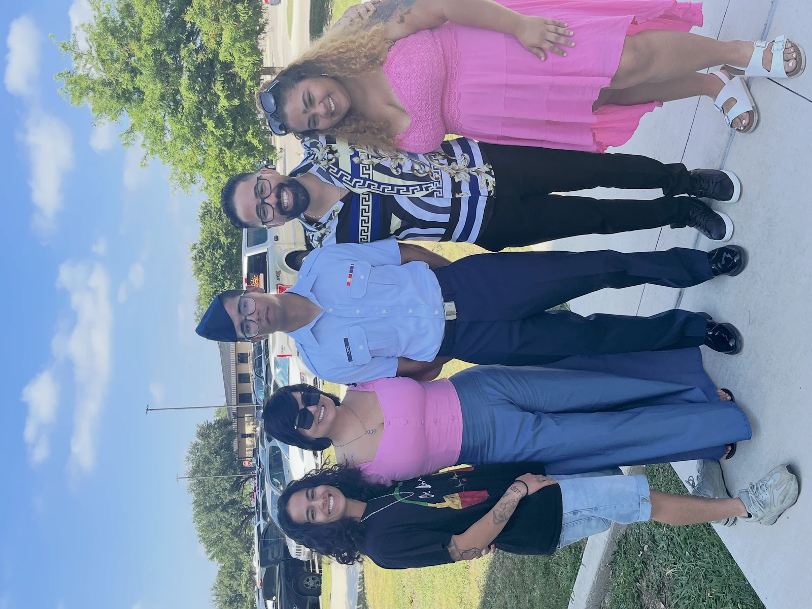 Jonathon in his Air Force dress uniform, standing with a group outdoors.